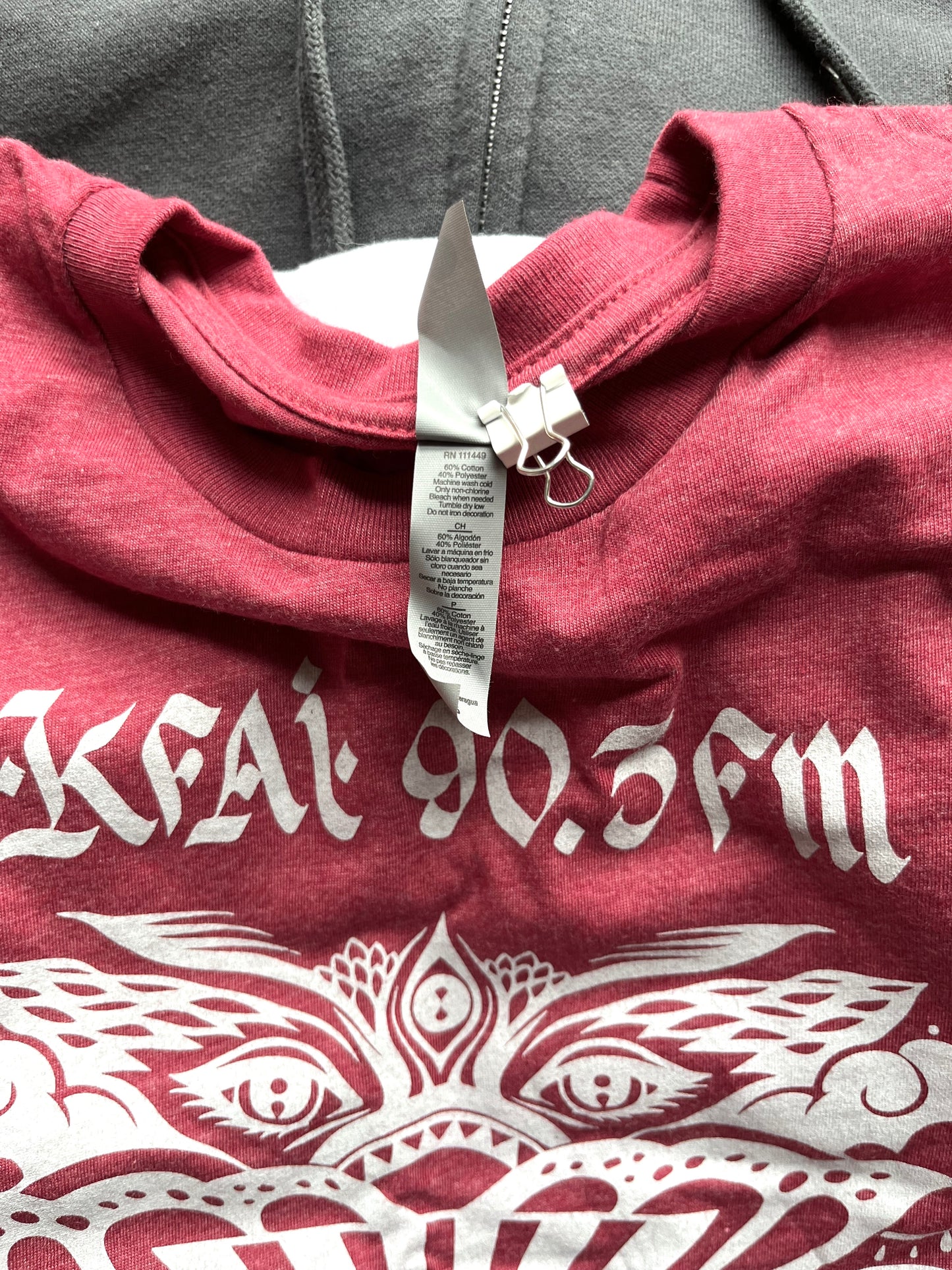 Close up of garment tag: 52% Airlume combed and ring-spun cotton, 48% polyester, 32 singles, 4.2 oz